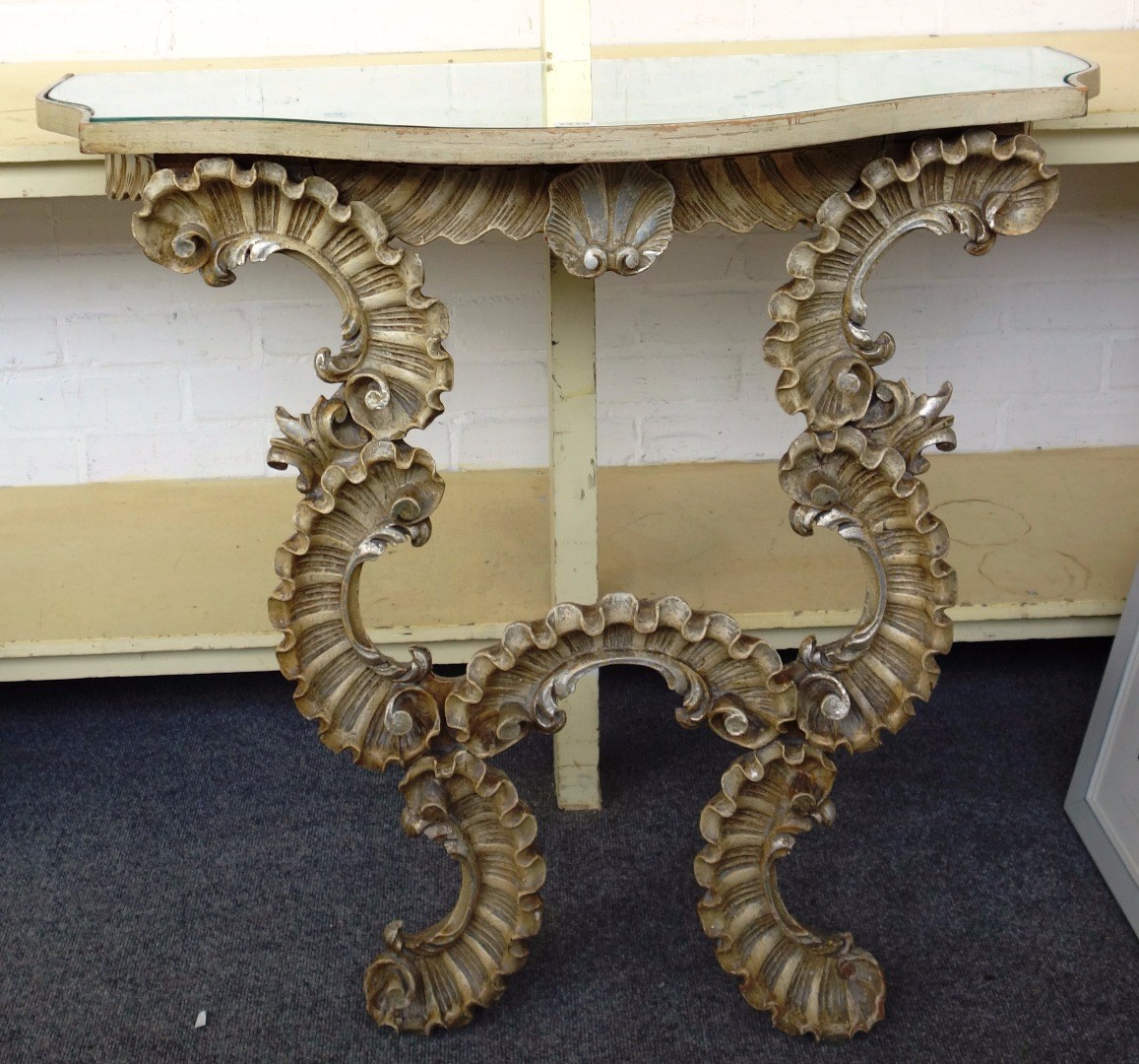 Appraisal: A pair of Italian th century style cream painted console