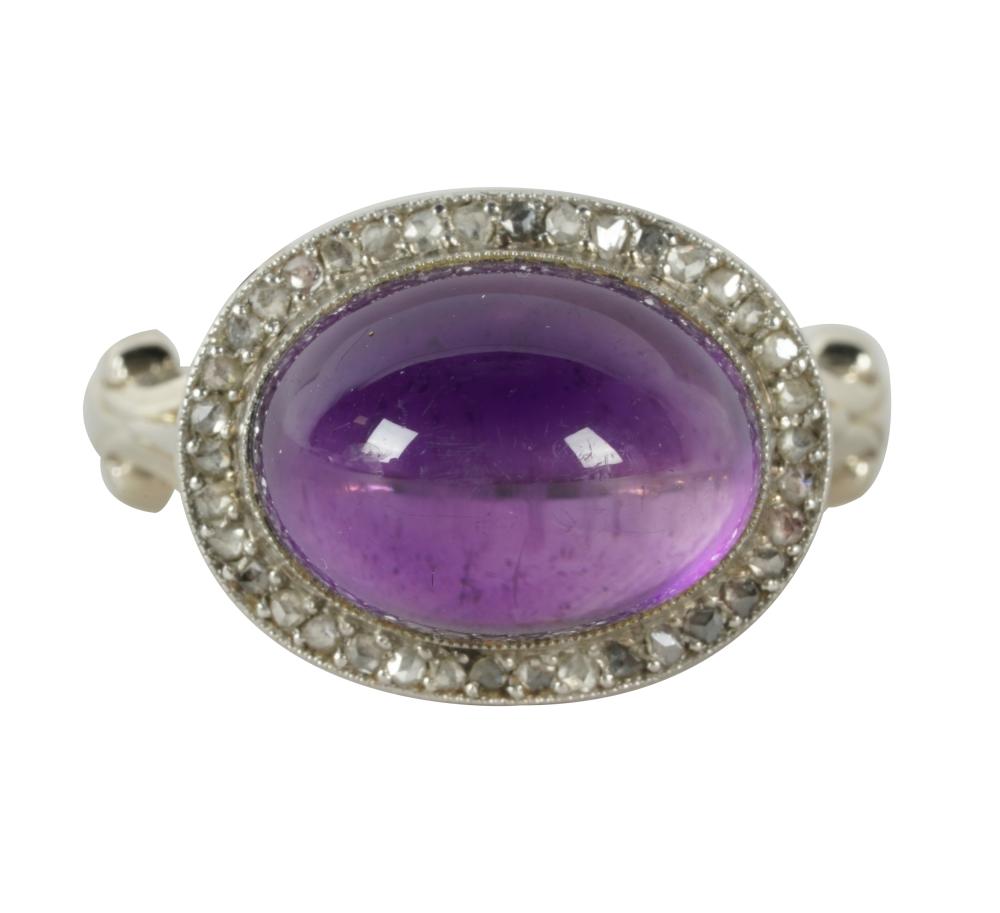 Appraisal: KARAT WHITE GOLD AMETHYST AND DIAMOND RINGcentering one oval cabochon