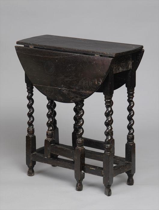 Appraisal: ENGLISH OAK GATE-LEG TABLE The rectangular top with hinged D-shaped