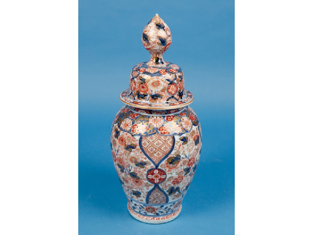 Appraisal: A JAPANESE IMARI VASE AND COVER decorated in underglaze blue