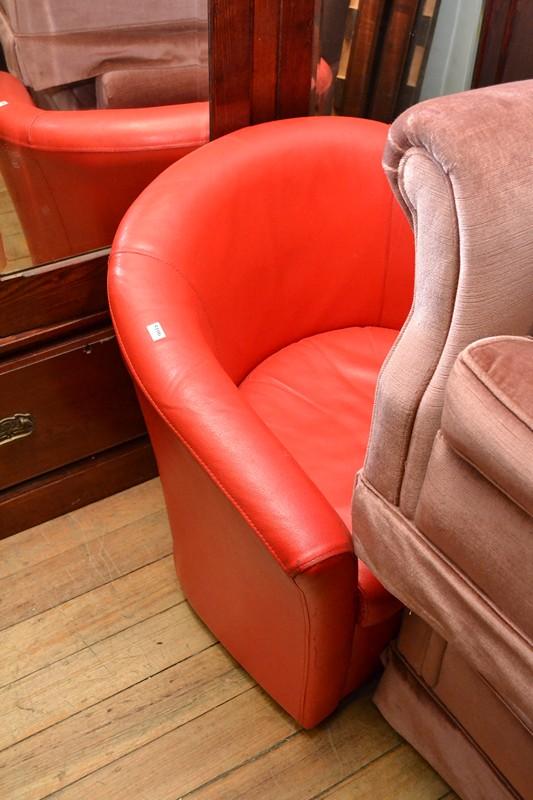 Appraisal: A RED VINYL UPHOLSTERED TUB CHAIR A RED VINYL UPHOLSTERED