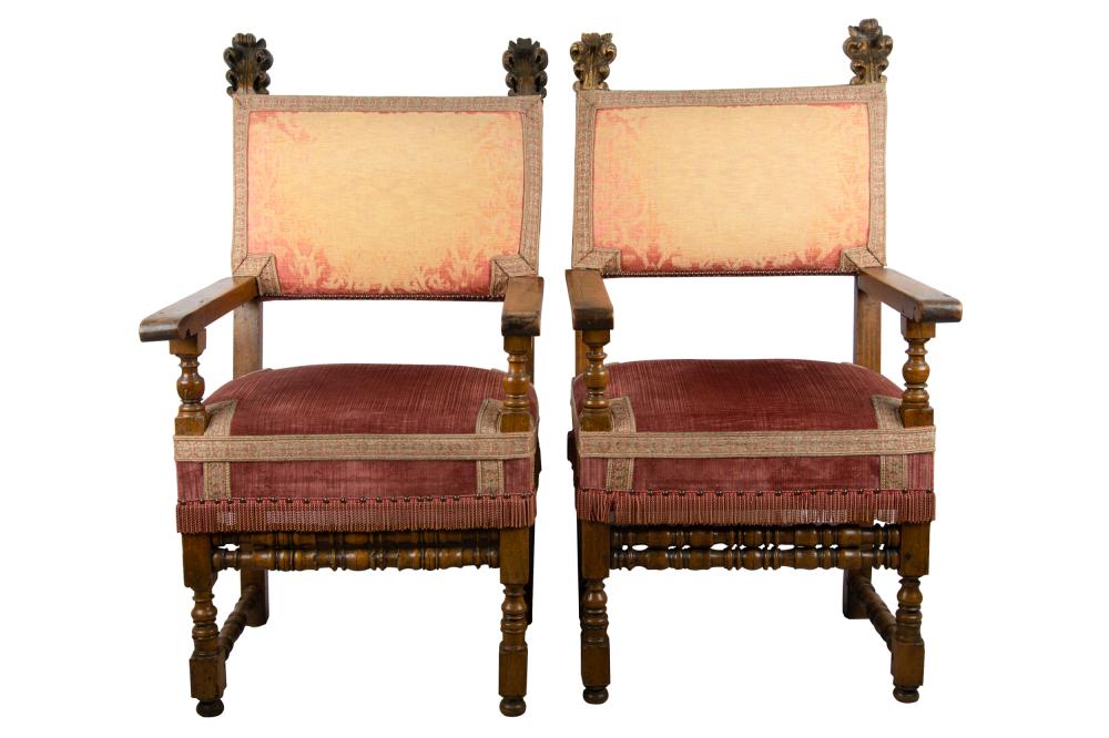 Appraisal: PAIR OF SPANISH CARVED WALNUT HALL CHAIRSwith foliate finials the