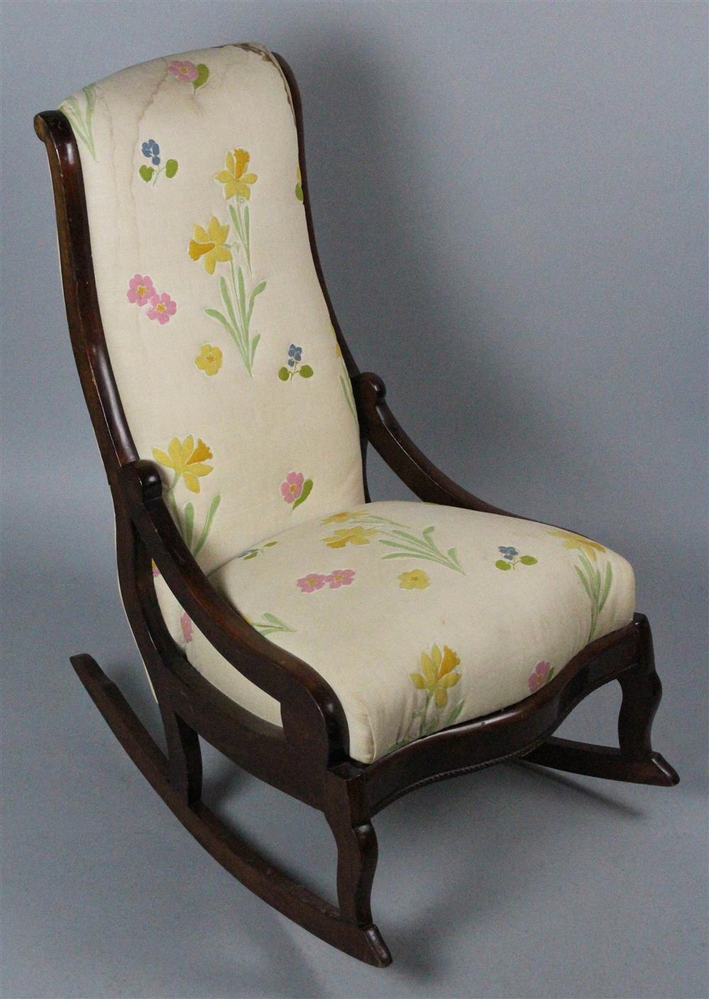 Appraisal: AMERICAN VICTORIAN MAHOGANY ROCKING CHAIR with an upholstered back and