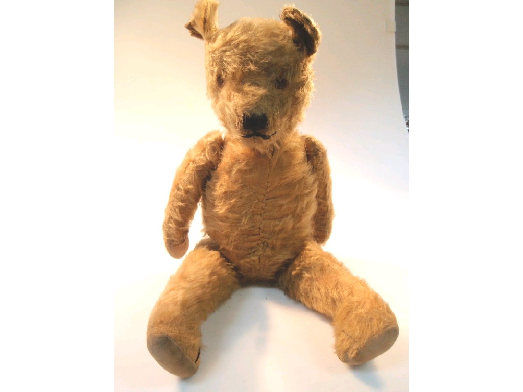 Appraisal: An early th C teddy bear with a gold mohair