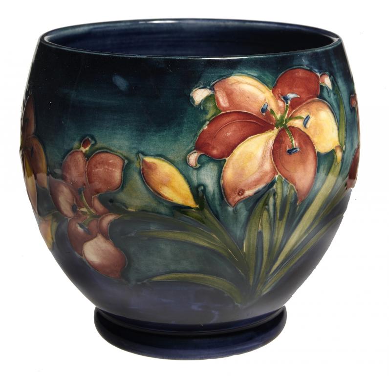 Appraisal: A MOORCROFT AFRICAN LILY CACHE POT DESIGNED BY WALTER MOORCROFT