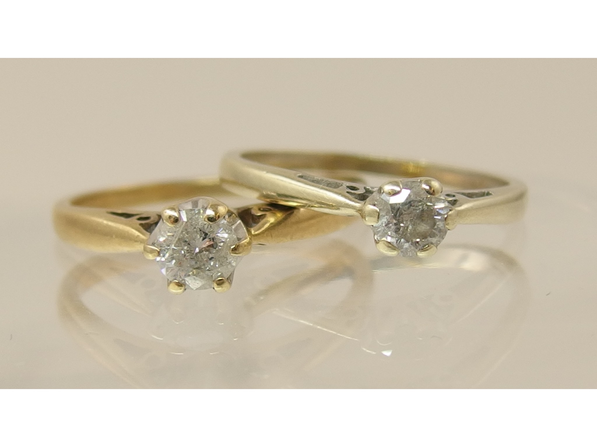 Appraisal: Two ct diamond solitaires one set with a diamond of