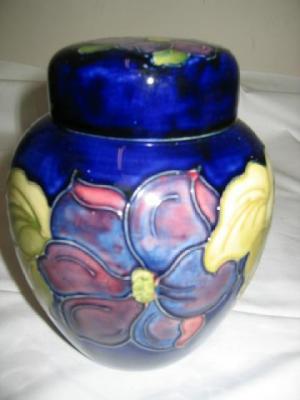 Appraisal: A MOORCROFT GINGER JAR AND COVER tube lined in Clematis