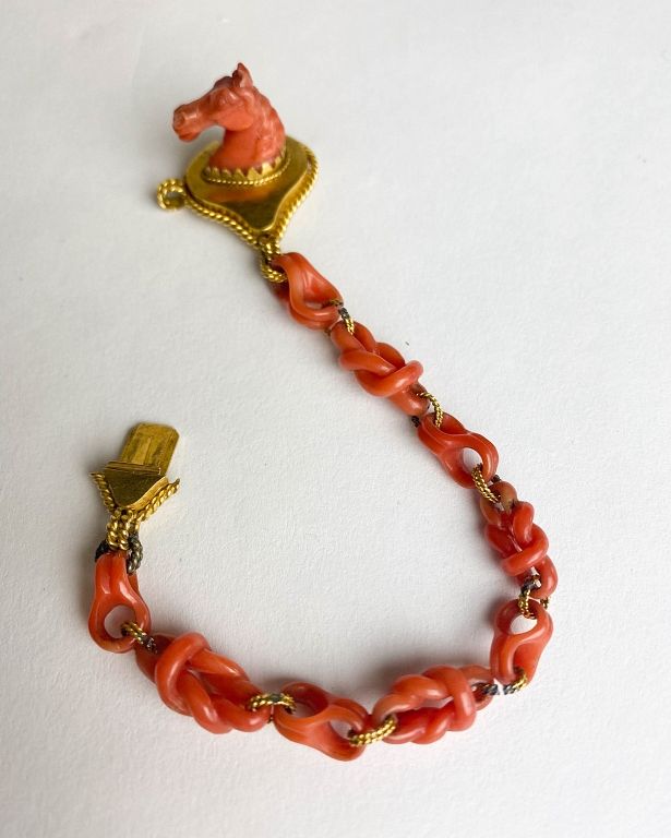 Appraisal: Red Coral Bracelet with Carved Horse Head Carved coral links