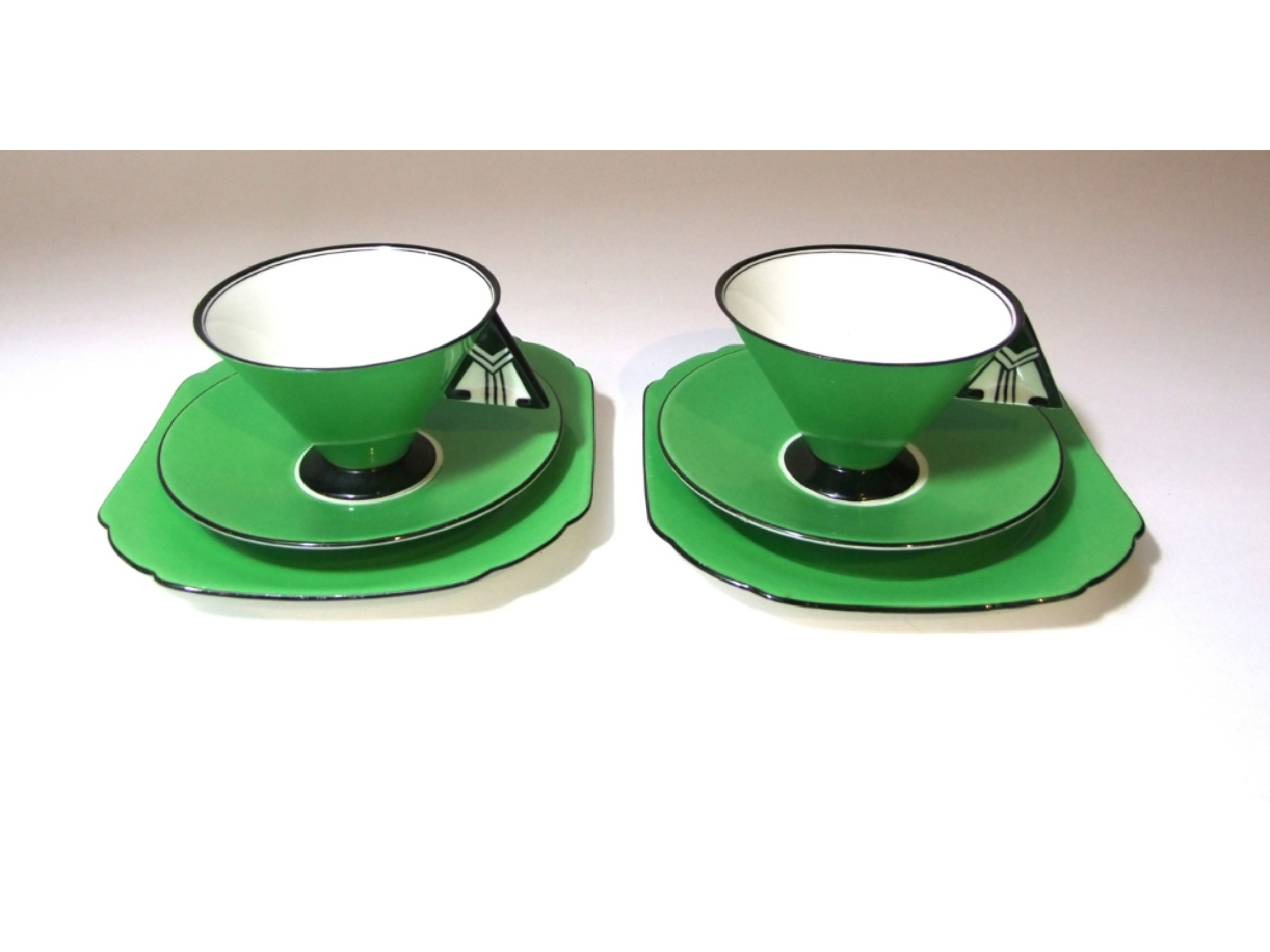 Appraisal: A pair of Shelley Vogue green ground trios in the