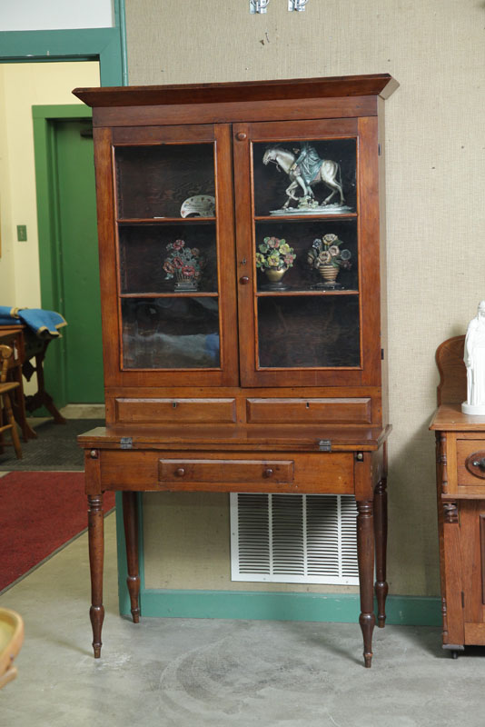 Appraisal: PLANTATION DESK Walnut with two glazed doors two drawers flip