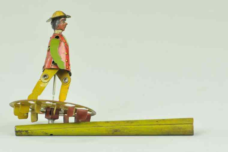 Appraisal: DANCING MAN PENNY TOY WHISTLE Attributed to Distler lithographed tin