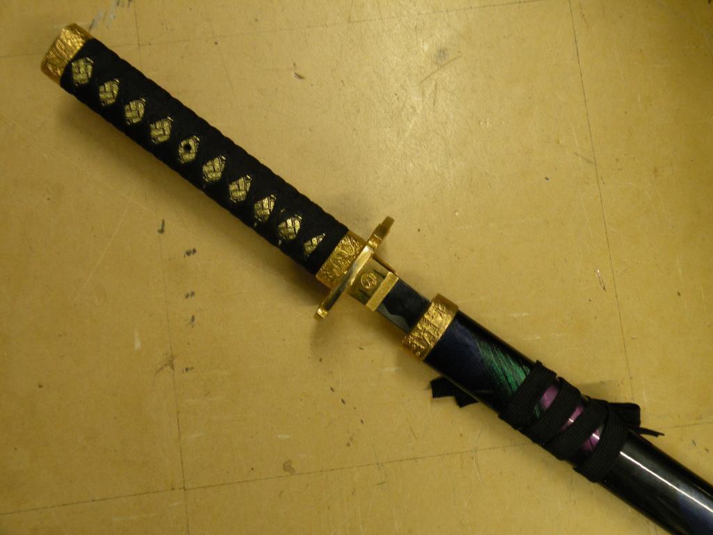 Appraisal: A modern Japanese replica Samurai sword with a coloured enamelled