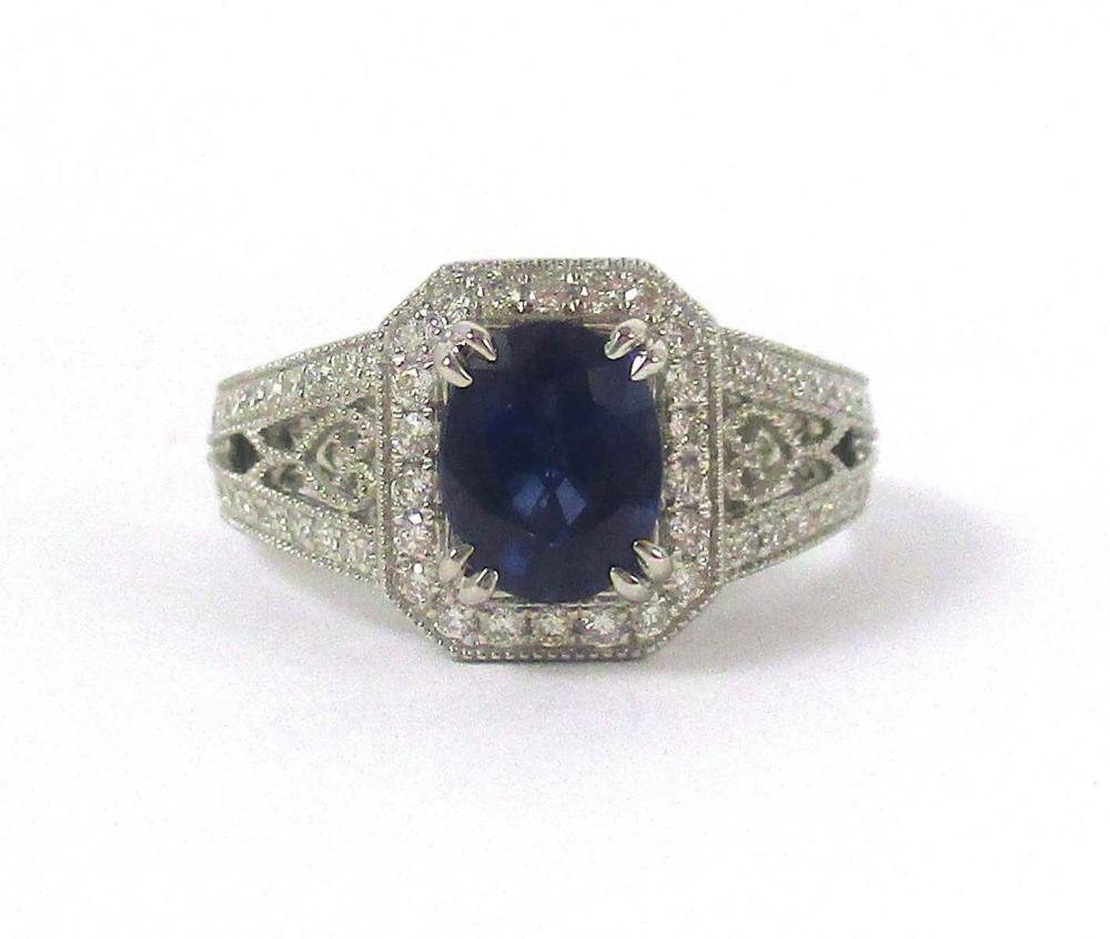 Appraisal: SAPPHIRE DIAMOND AND FOURTEEN KARAT WHITE GOLD RING with round-cut