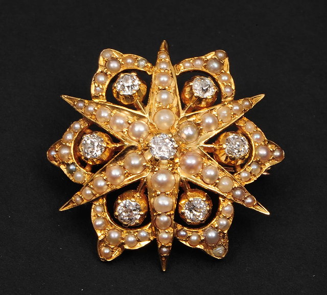 Appraisal: An ct gold brooch pendantof star burst form with diamond