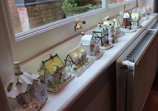 Appraisal: A COLLECTION OF ELEVEN COALPORT PORCELAIN MODELS of cottages and