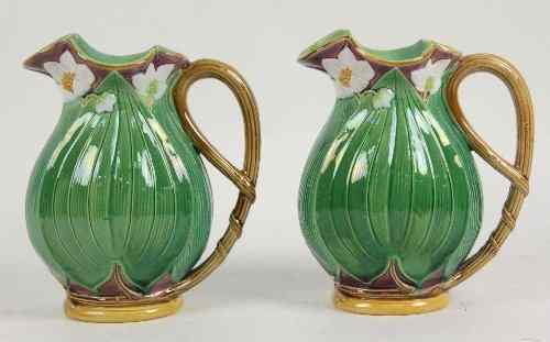 Appraisal: A pair of Minton majolica leaf moulded water jugs cm