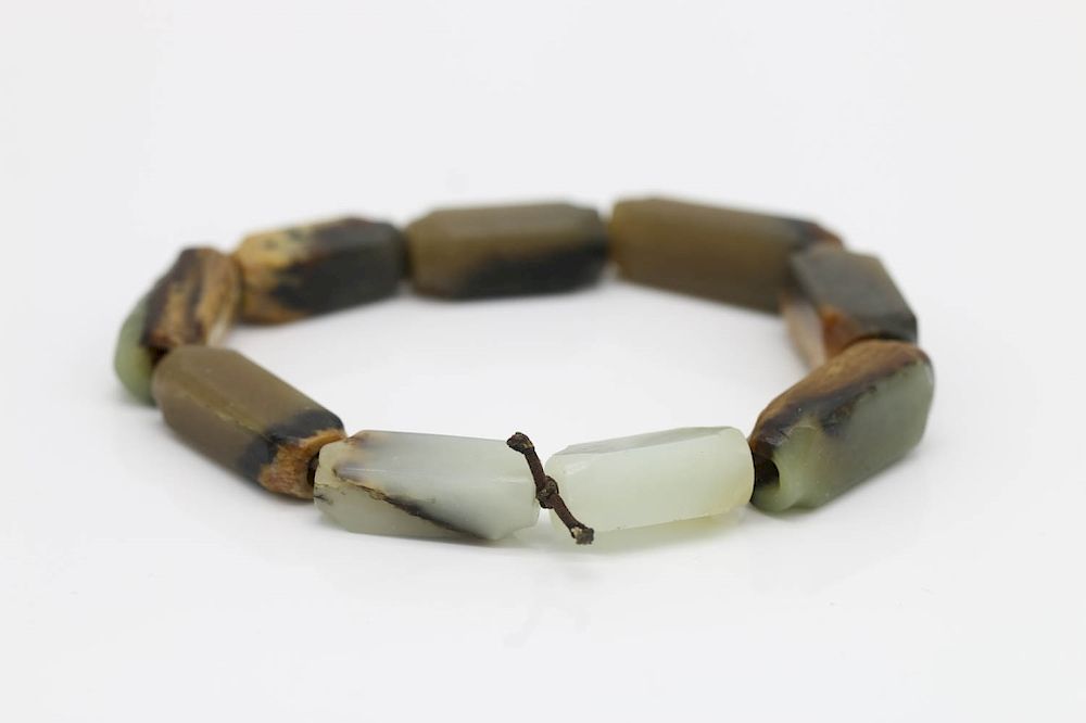 Appraisal: JADE BRACELET composed of miniature cong form jade pieces with