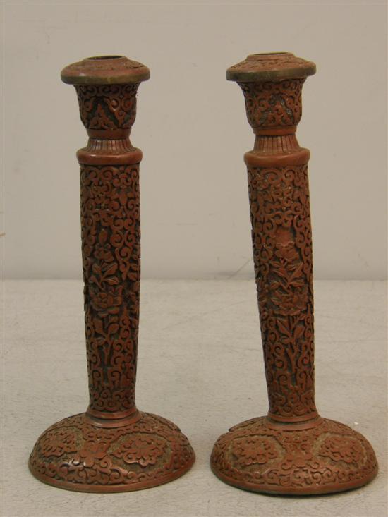 Appraisal: Pair of th century Chinese carved red lacquer candlesticks h