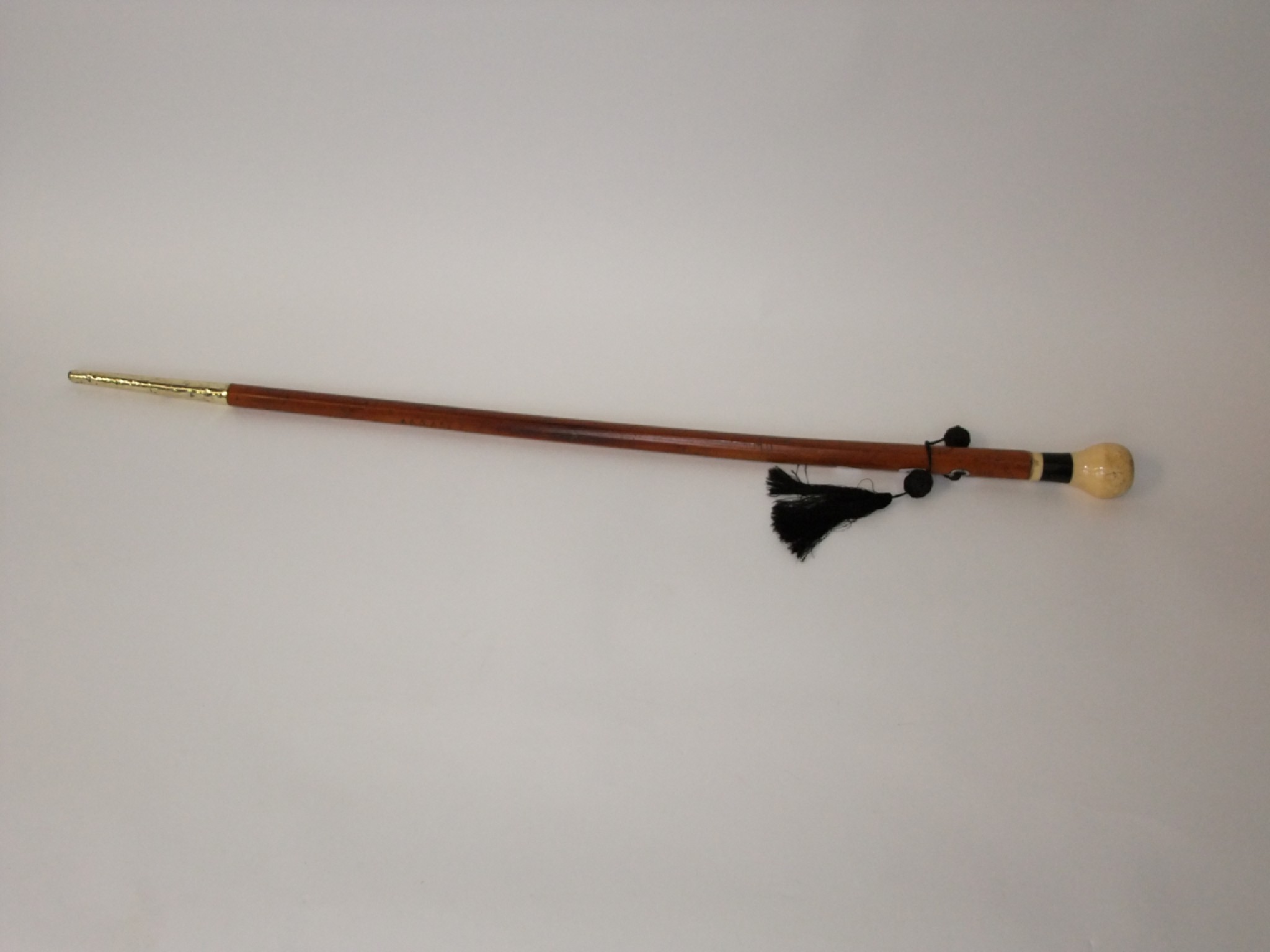 Appraisal: An antique Malacca walking cane of tapering form terminating an