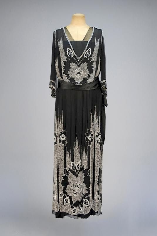 Appraisal: EDWARDIAN BEADED SILK GOWN Black silk having short bell sleeve