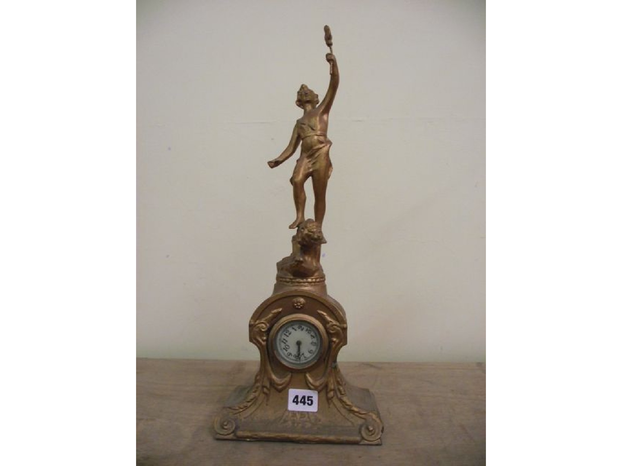 Appraisal: An Edwardian spelter mantel clock enclosing a small -day timepiece