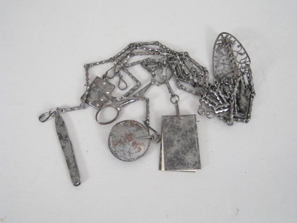 Appraisal: A th Century cut steel Chatelaine with knife scissors pin