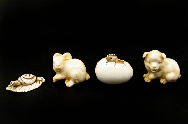 Appraisal: A group of six contemporary carved ivory Netsuke height in