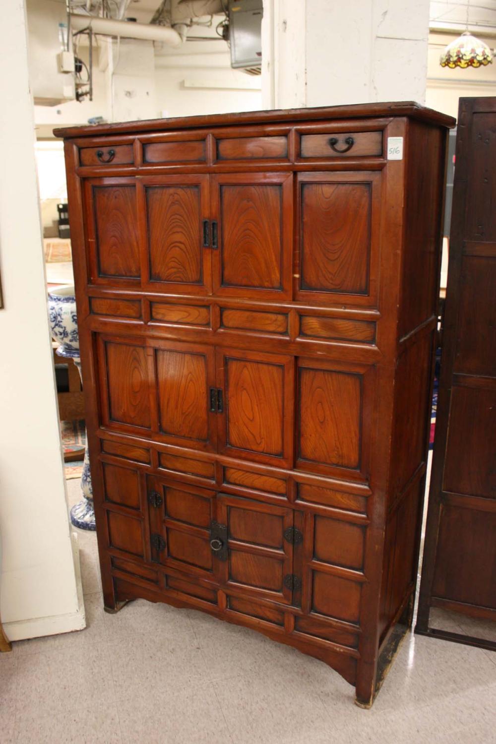 Appraisal: ANTIQUE KOREAN THREE-LEVEL KITCHEN CABINET featuring bold grain elmwood panels