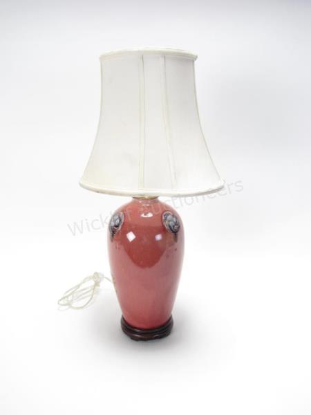 Appraisal: English Moorcroft Flamminian Ware pottery lamp with maroon glaze and