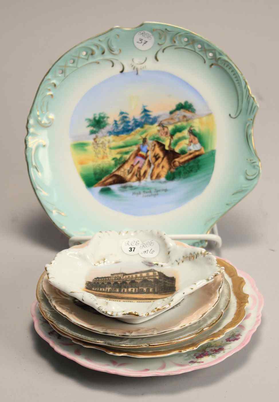 Appraisal: SIX SOUVENIR PLATES Four-lobed dish depicting the United States Hotel