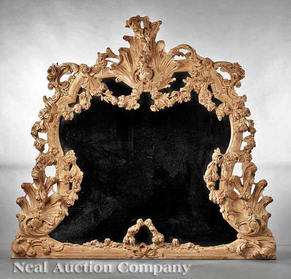 Appraisal: A German Carved and Limed Wood Mirror elaborate scrolled and