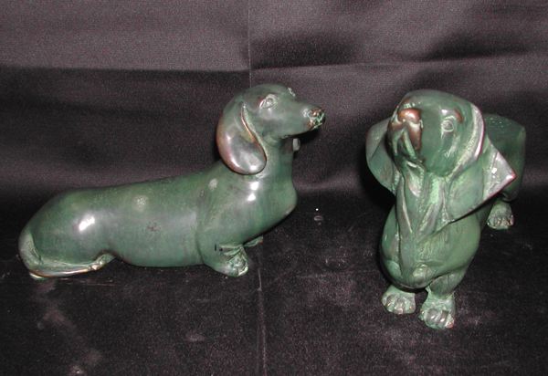 Appraisal: Good Pair of Patinated Bronze Figure of respectively a standing