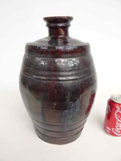 Appraisal: Rare thc eastern Penna redware water jug Dark brown over