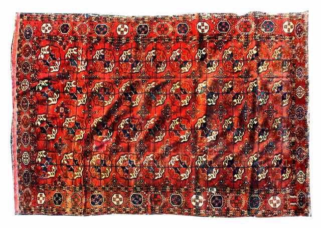 Appraisal: A TURKOMAN MAIN CARPET decorated four rows of guls on