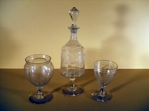 Appraisal: GROUP OF THREE ENGRAVED GLASS ITEMS Including a footed carafe