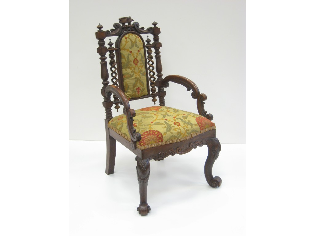 Appraisal: A Victorian Carolean style Armchair heavily carved with scrollwork and