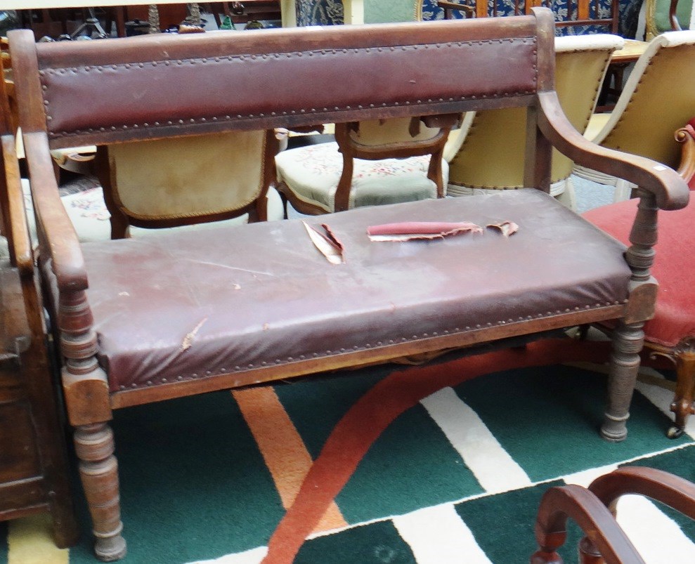 Appraisal: A th century mahogany open arm bench on turned supports