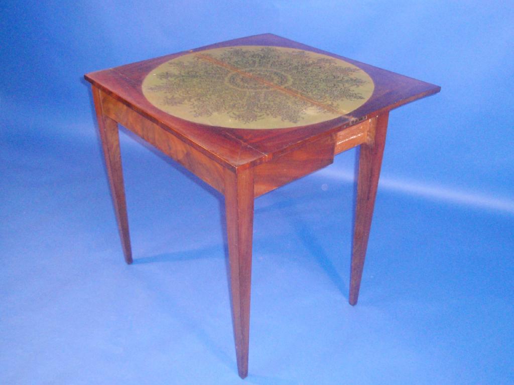 Appraisal: A George III flamed mahogany card table with folding rectangular