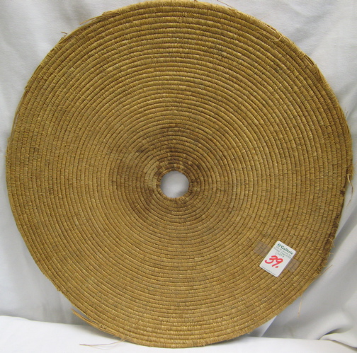 Appraisal: AN ALASKAN ESKIMO INDIAN MAT-TRAY round coiled of beach grass