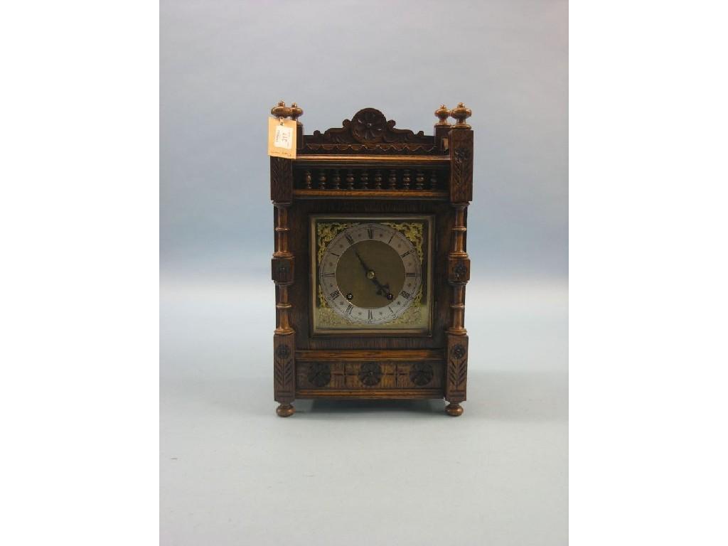 Appraisal: A Victorian dark oak mantel clock traditional square dial and