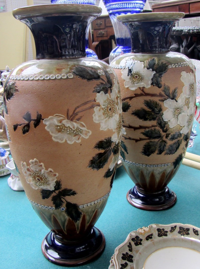 Appraisal: A pair of Royal Doulton saltglaze stoneware vases decorated with