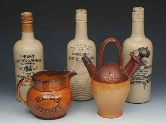 Appraisal: ADVERTISING Three stoneware ammonia bottles th Century a Reid's stout