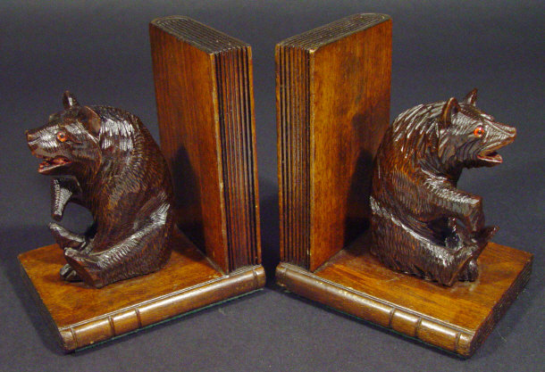 Appraisal: Pair of Black Forest carved wooden bear bookends set with