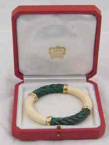 Appraisal: Cartier a fine boxed ivory malachite and gold bangle by