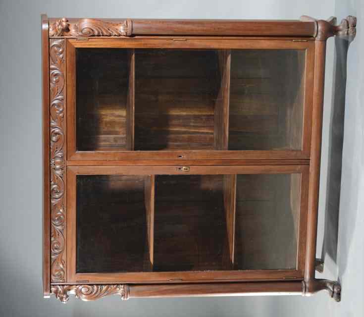 Appraisal: CARVED MAHOGANY CABINET BOOKCASE in the manner of R J