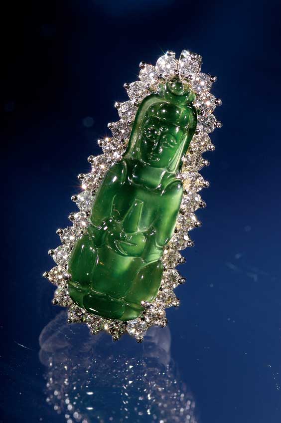 Appraisal: JADE AND DIAMOND PENDANT Nearly transparent and finely carved emerald