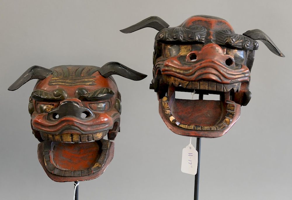 Appraisal: Pair of Japanese red and black lacquer shi shi masks