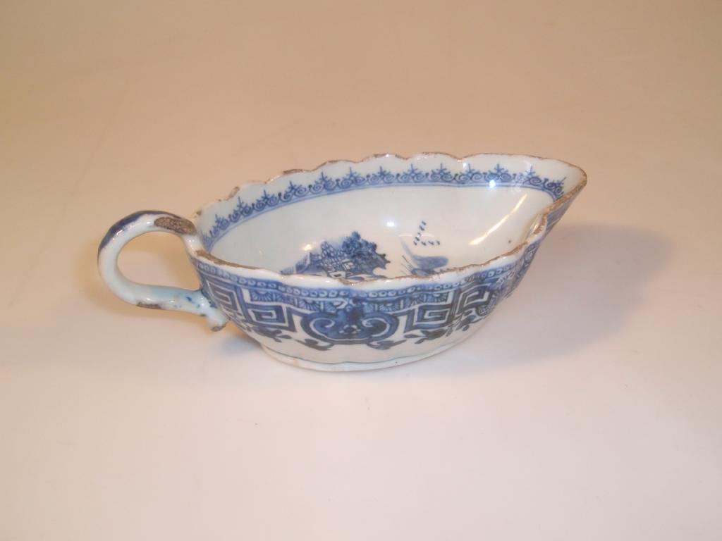 Appraisal: An thC Chinese sauce boat of lobed form painted in