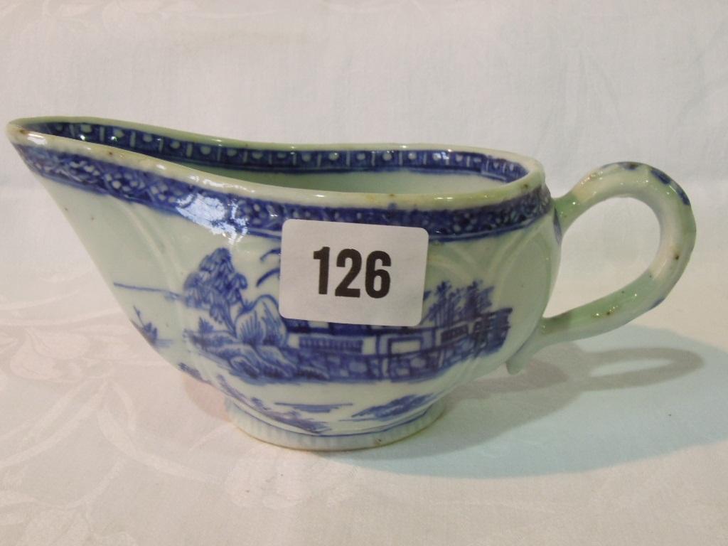 Appraisal: An th century sauce boat with blue and white painted