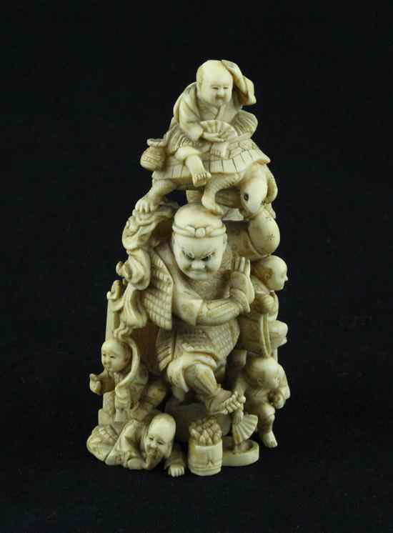 Appraisal: A Meiji period ivory netsuke carved as Shoki holding aloft